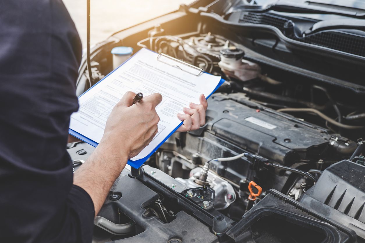 Automotive mechanic performing a full vehicle inspection on Monday morning